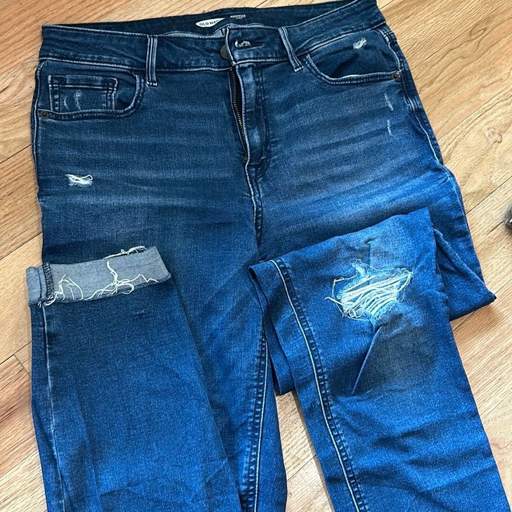 Skinny distressed denim, patch behind hole on knee.